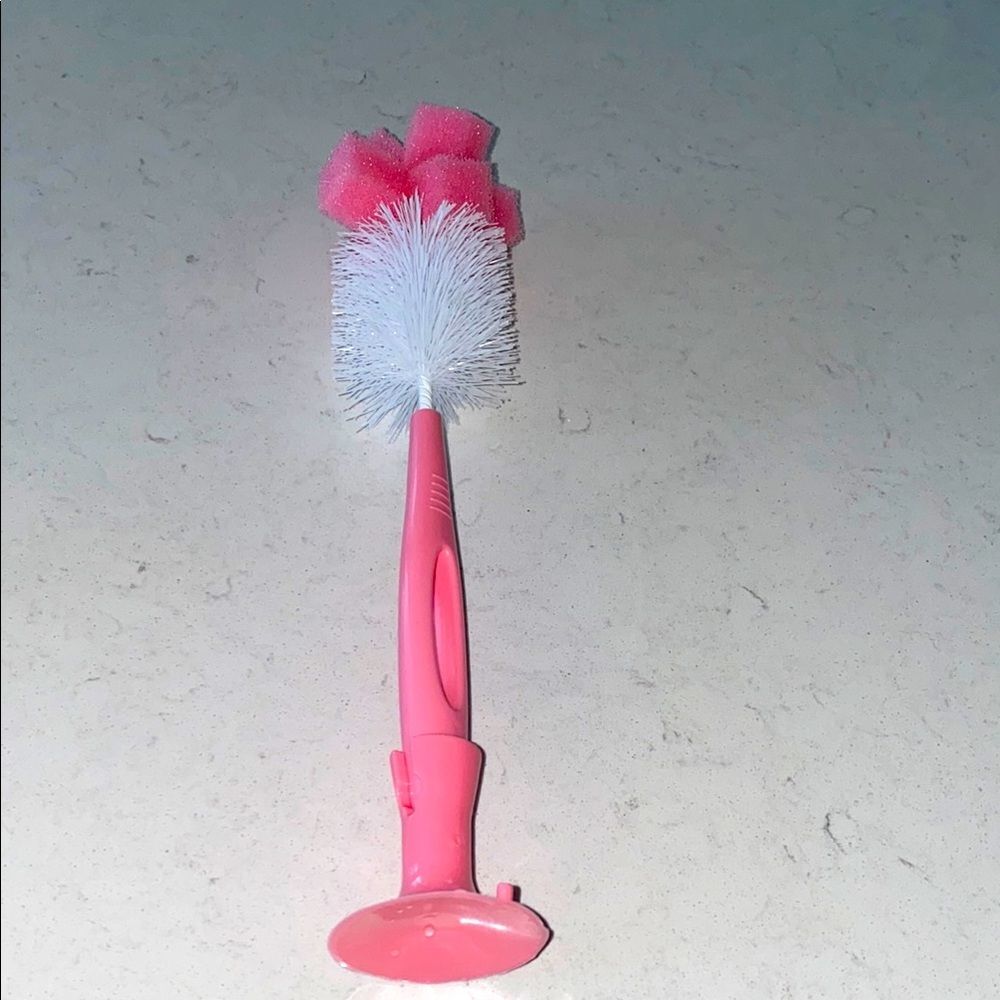Pink and White Cleaning Brush
